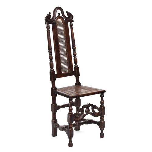 369 - A William & Mary oak side chair, caned back and set, pineapple cross stretcher, the back 127cm high,... 