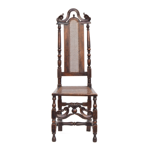 369 - A William & Mary oak side chair, caned back and set, pineapple cross stretcher, the back 127cm high,... 