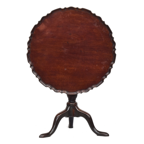 389 - An 18th century mahogany tripod table, the piecrust tilt top with birdcage action, on a wrythen colu... 