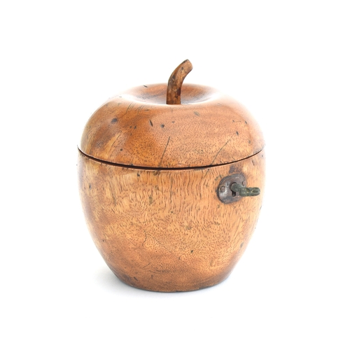 225 - A treen fruitwood tea caddy in the form of an apple, the hinged lid with stalk finial, approx. 11.5c... 