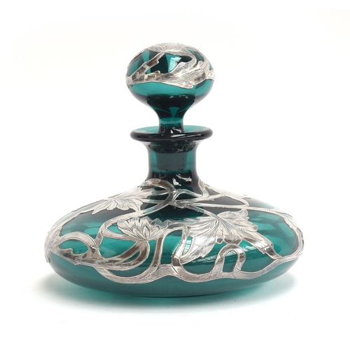 253 - An early 20th century green glass silver mounted dressing table bottle, marked 'Sterling', 11cm high