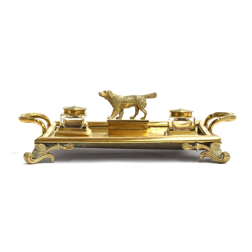 210 - A large Victorian brass desk inkstand with two cut glass lidded inkwells and a central box surmounte... 