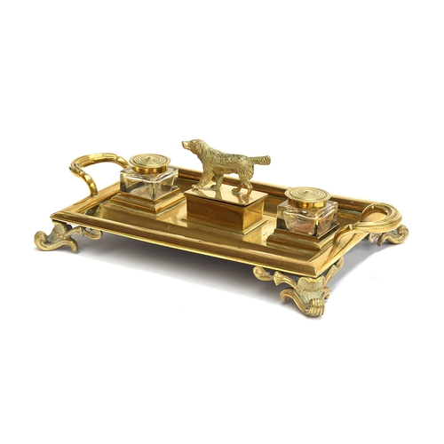 210 - A large Victorian brass desk inkstand with two cut glass lidded inkwells and a central box surmounte... 