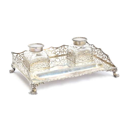 209 - A Victorian silver ink stand by John Wilmin Figg, London 1883, having two cut glass wells, with a pi... 