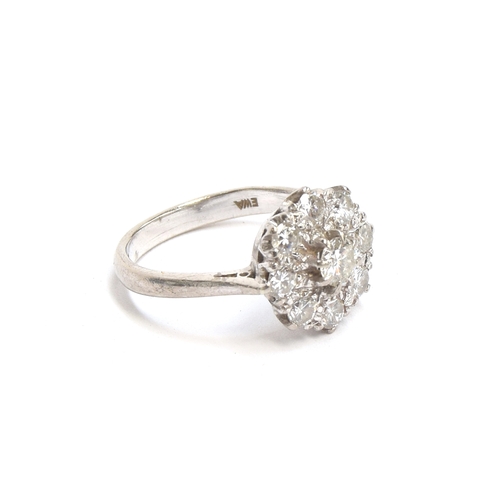 18 - An 18ct white gold diamond cluster ring, total diamond carat approx. 1.5cts, size N 1/2, hallmarked ... 