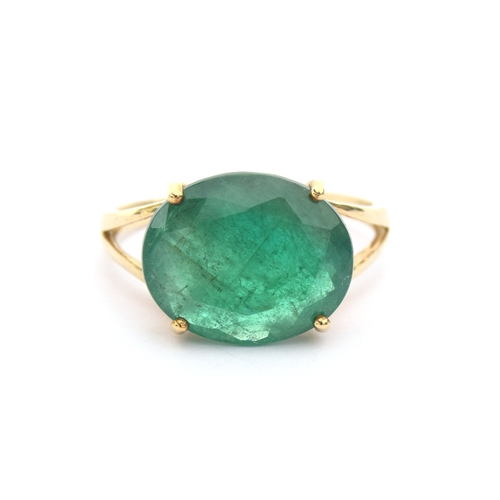 46 - A 9ct gold ring set with an oval cut Bahia emerald, approx 5.3cts, size N 1/2, 2.5g purchased by the... 