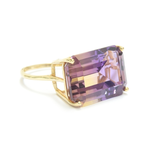 134 - A 9ct gold ametrine cocktail ring, the emerald cut Anahi ametrine weighing 15.2cts, size O, 5.1g

Pr... 