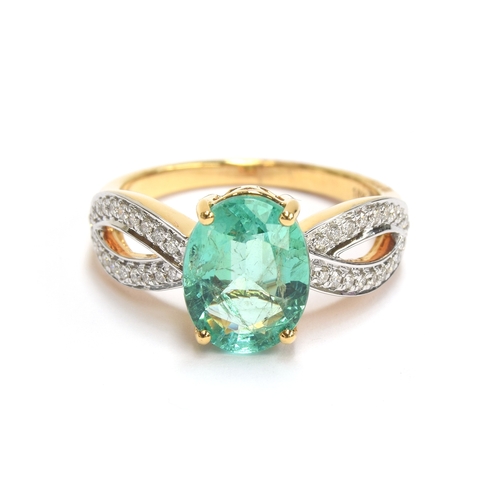 42 - An 18ct gold ring set with an emerald and diamonds, the oval cut Ethiopian emerald weighing 2.1cts, ... 