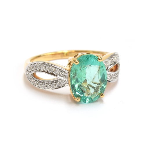 42 - An 18ct gold ring set with an emerald and diamonds, the oval cut Ethiopian emerald weighing 2.1cts, ... 