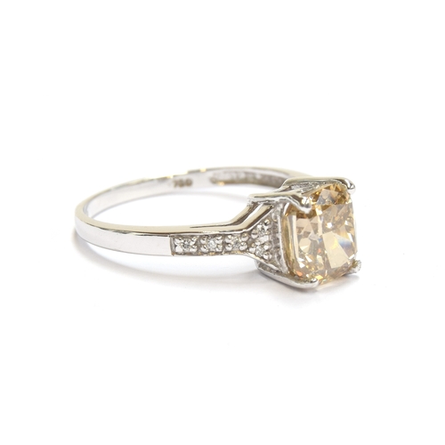 47 - An 18ct white gold ring set with a large Argyle champagne diamond, the cushion cut diamond weighing ... 