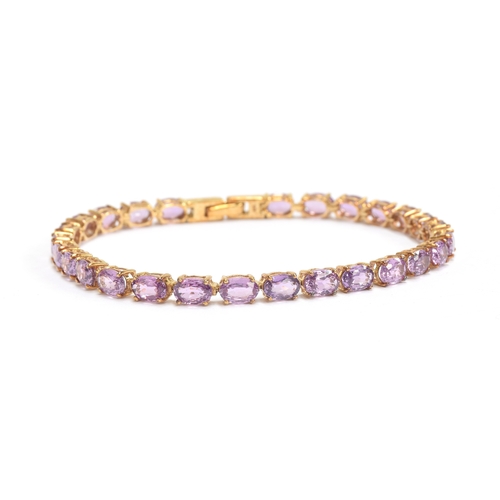 93 - A 9ct gold mounted Ceylon purple sapphire bracelet, the oval cut sapphires totalling 14.7cts, 19cm l... 