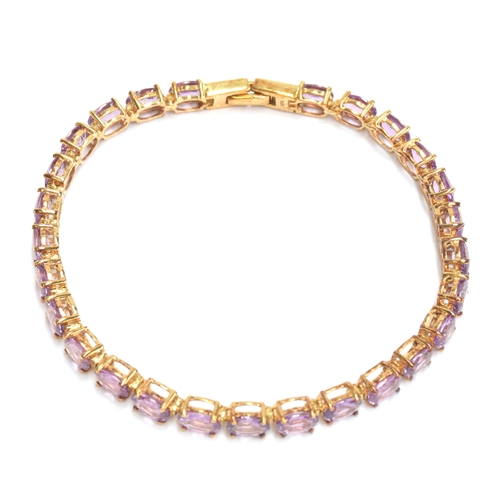 93 - A 9ct gold mounted Ceylon purple sapphire bracelet, the oval cut sapphires totalling 14.7cts, 19cm l... 