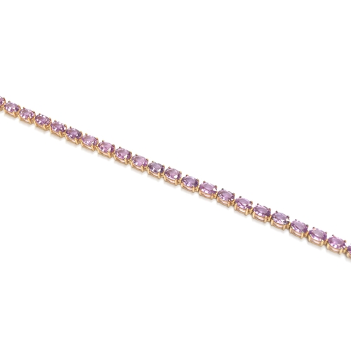 93 - A 9ct gold mounted Ceylon purple sapphire bracelet, the oval cut sapphires totalling 14.7cts, 19cm l... 