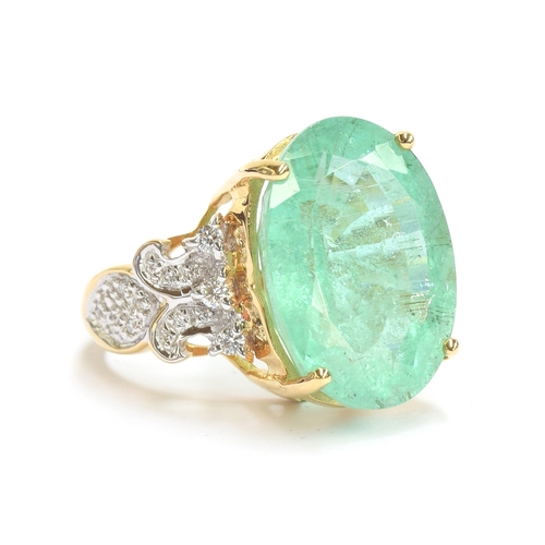 81 - An 18ct gold Brazilian paraiba tourmaline and diamond ring, the large tourmaline weighing 17.87cts a... 