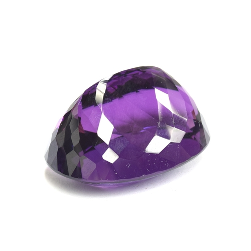 112 - A large unmounted Lusaka Amethyst, the oval faceted stone weighing 168.6cts, measuring 40x32mm, purc... 