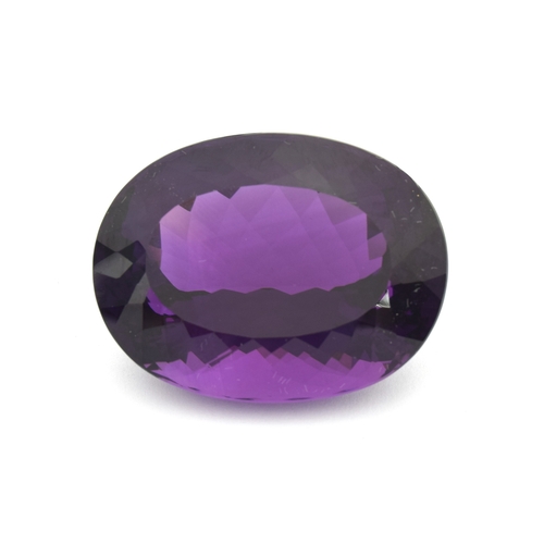 112 - A large unmounted Lusaka Amethyst, the oval faceted stone weighing 168.6cts, measuring 40x32mm, purc... 