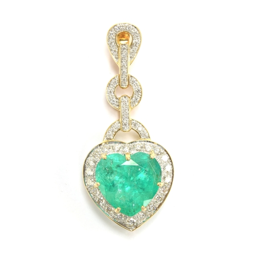 43 - An 18ct gold emerald and diamond pendant, the large heart cut Colombian emerald weighing 10.8cts and... 