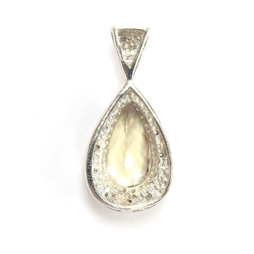 89 - An 18ct white gold, zultanite and diamond pendant, the pear cut zultanite 4.5cts and measuring 15x9m... 