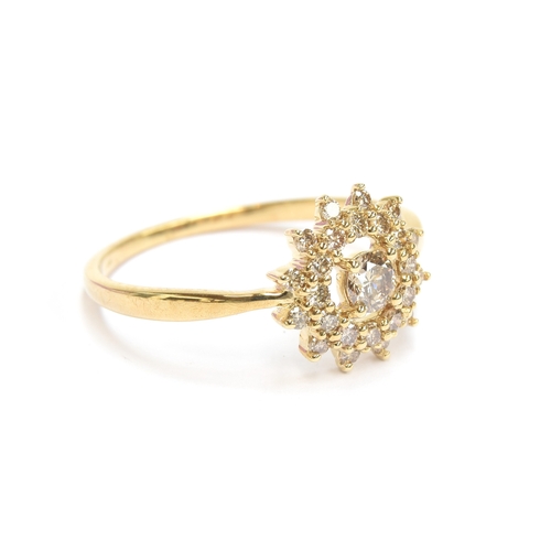 65 - A 9ct gold starburst cluster ring set with Argyle diamonds totalling 0.5cts, size R 1/2, gross weigh... 