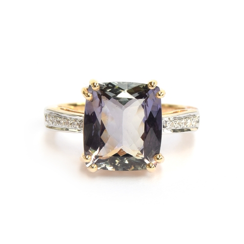 102 - A 14ct gold bicolour tanzanite and diamond ring, the cushion cut tanzanite 5cts and measuring 11.2x1... 