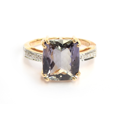 102 - A 14ct gold bicolour tanzanite and diamond ring, the cushion cut tanzanite 5cts and measuring 11.2x1... 