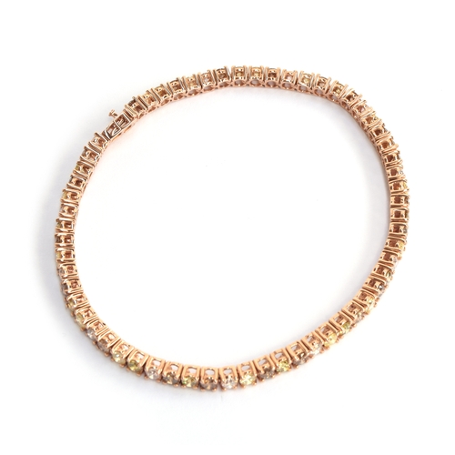 91 - A 14ct rose gold diamond tennis bracelet set with champagne, green, yellow and pink diamonds totalli... 