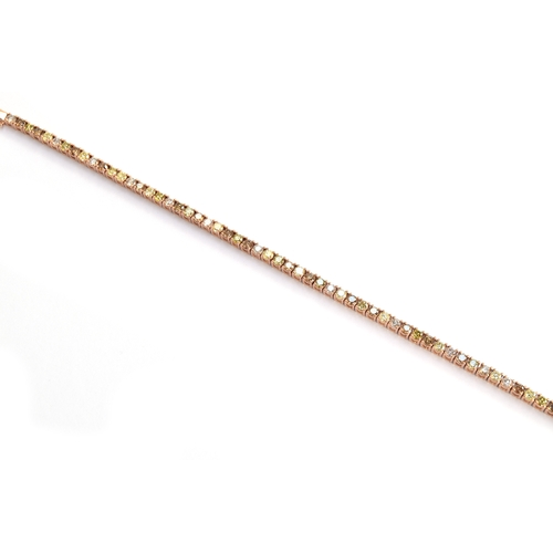 91 - A 14ct rose gold diamond tennis bracelet set with champagne, green, yellow and pink diamonds totalli... 