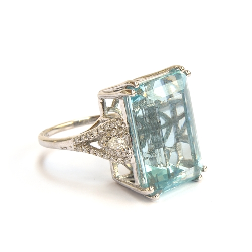 34 - An 18ct white gold mounted aquamarine and diamond ring, the emerald cut aquamarine weighing 19.71cts... 