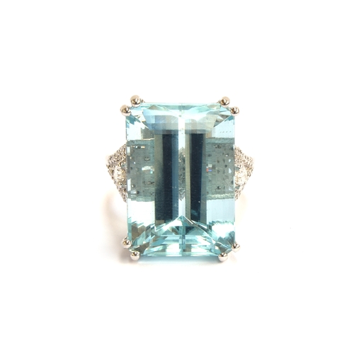 34 - An 18ct white gold mounted aquamarine and diamond ring, the emerald cut aquamarine weighing 19.71cts... 