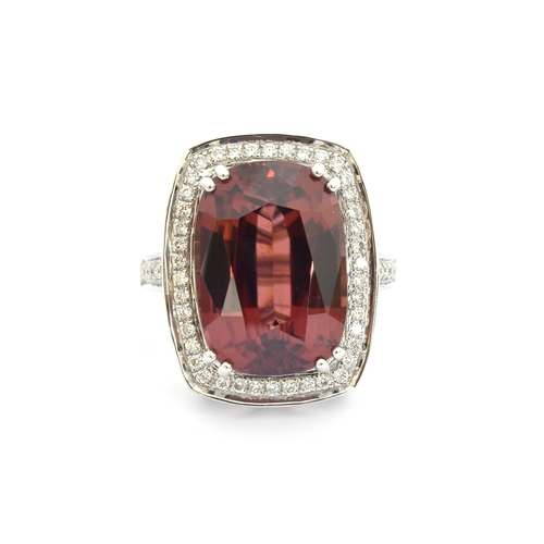 98 - An 18ct white gold ring set with a large Ratanakiri red zircon and diamonds, the zircon 19.5cts and ... 