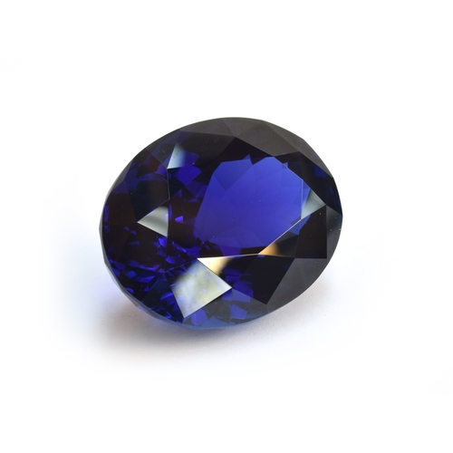 110 - An exceptional unmounted tanzanite weighing 135cts, oval modified brilliant cut, accompanied with IG... 