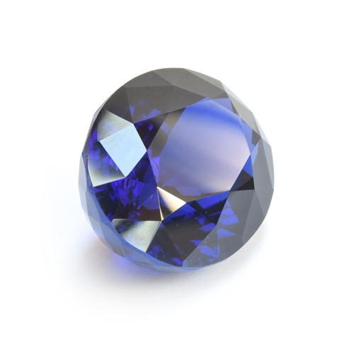 110 - An exceptional unmounted tanzanite weighing 135cts, oval modified brilliant cut, accompanied with IG... 