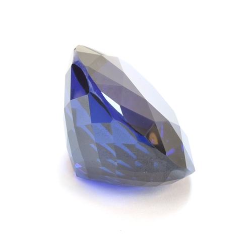 110 - An exceptional unmounted tanzanite weighing 135cts, oval modified brilliant cut, accompanied with IG... 