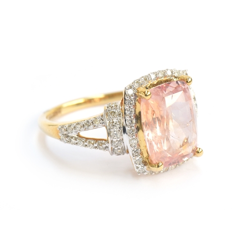 99 - An 18ct gold padparadscha sapphire and diamond ring, the cushion cut sapphire 4.7cts and measuring 1... 