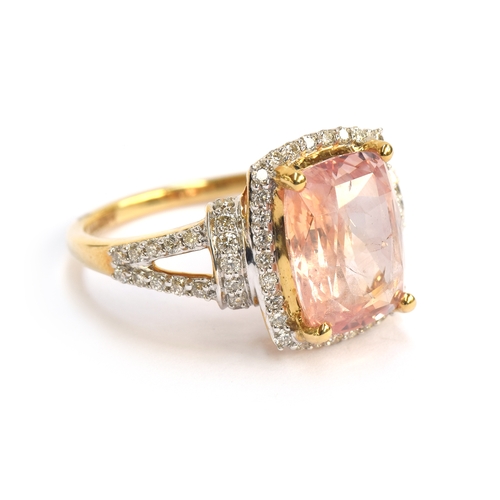 99 - An 18ct gold padparadscha sapphire and diamond ring, the cushion cut sapphire 4.7cts and measuring 1... 