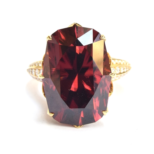 122 - A Kat Florence 18ct gold, red zircon and diamond ring, the natural red zircon 30.7cts and 20x4x14.3m... 