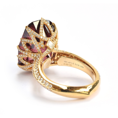 122 - A Kat Florence 18ct gold, red zircon and diamond ring, the natural red zircon 30.7cts and 20x4x14.3m... 