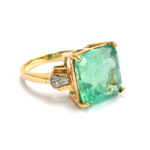 39 - An 18ct gold, emerald and diamond ring, the Muzo Colombian emerald 8.69cts and 12.5x12mm, size N 1/2... 