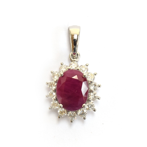 117 - A platinum mounted ruby and diamond cluster pendant, the Burmese ruby 3.25cts and 10x8mm, diamonds t... 