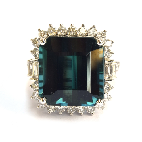 33 - An 18ct white gold, blue tourmaline and diamond cluster ring, the Monte Belo indicolite tourmaline 1... 