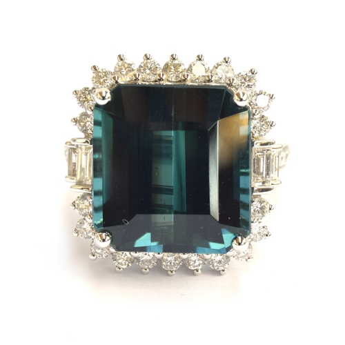 33 - An 18ct white gold, blue tourmaline and diamond cluster ring, the Monte Belo indicolite tourmaline 1... 