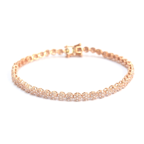 75 - A 9ct rose gold diamond bracelet, the diamonds totalling 2cts, 19cm long unclasped, approx. 19cm lon... 