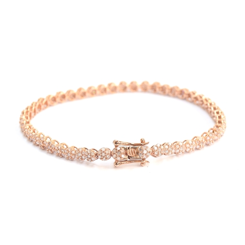 75 - A 9ct rose gold diamond bracelet, the diamonds totalling 2cts, 19cm long unclasped, approx. 19cm lon... 