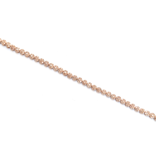 75 - A 9ct rose gold diamond bracelet, the diamonds totalling 2cts, 19cm long unclasped, approx. 19cm lon... 