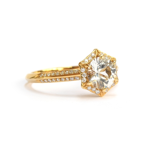 130 - A Kat Florence 18ct gold, white sapphire and diamond hexagonal cluster ring, the Ceylon white sapphi... 