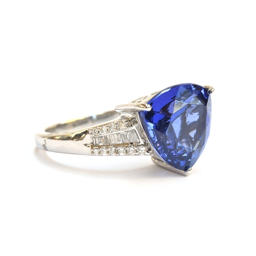 104 - A platinum, tanzanite and diamond ring, the trillion cut tanzanite 7.5cts and 12mm wide, diamonds to... 