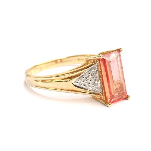 100 - A 9ct gold, padparadscha sapphire and diamond ring, the baguette cut padparadscha sapphire 1.6cts an... 