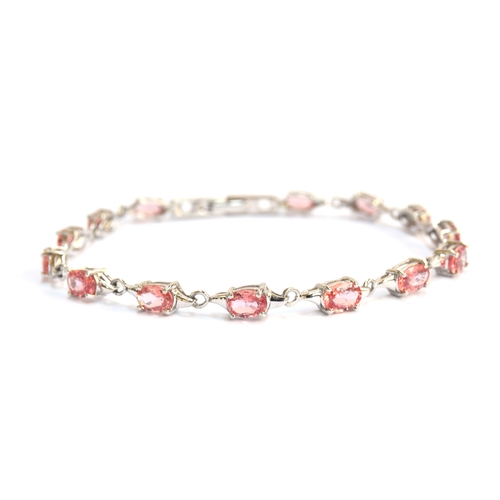 95 - A 9ct white gold and padparadscha sapphire bracelet, the sapphires totalling 6.8cts, gross weight 7.... 