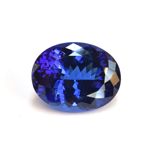 111 - A very large unmounted tanzanite, the oval mixed cut stone 32.18cts and measuring 22.32x17.45x11.63,... 