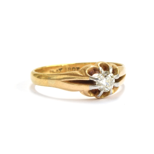 5 - An early 20th century 18ct gold diamond solitaire ring in a buttercup setting with platinum tipped c... 